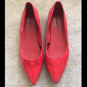 Shiny red pointed toe flats